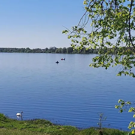у реки *